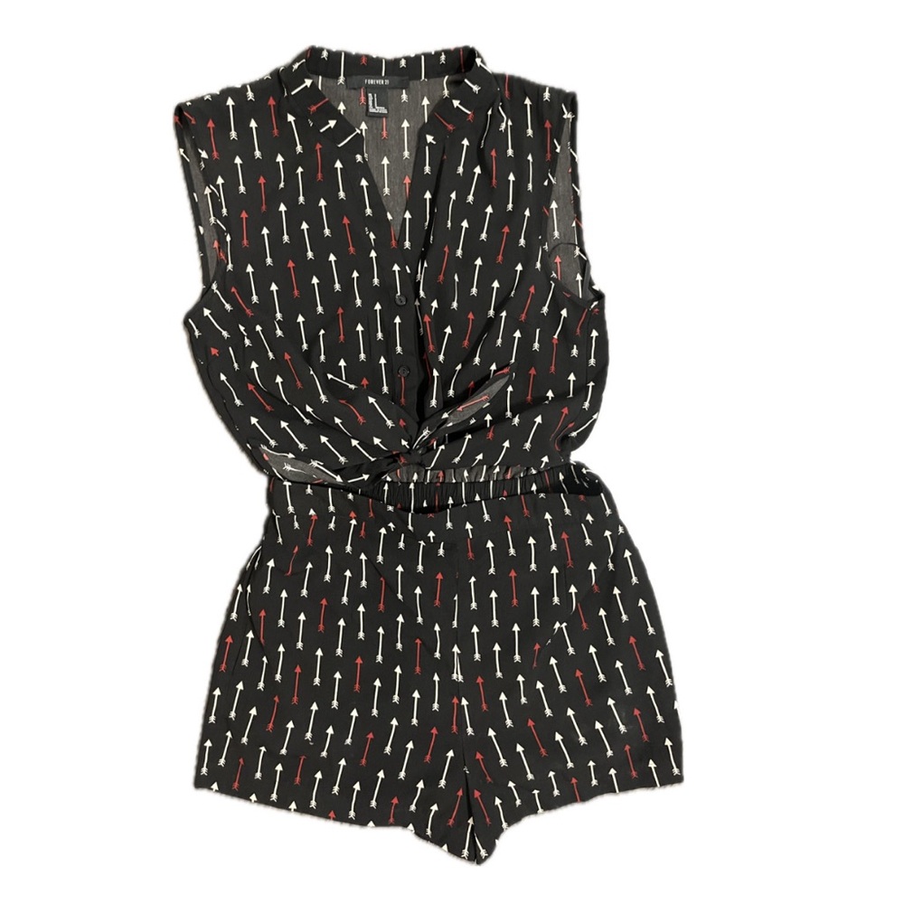 Black romper with white and red arrows. Size Small. Ties in the center